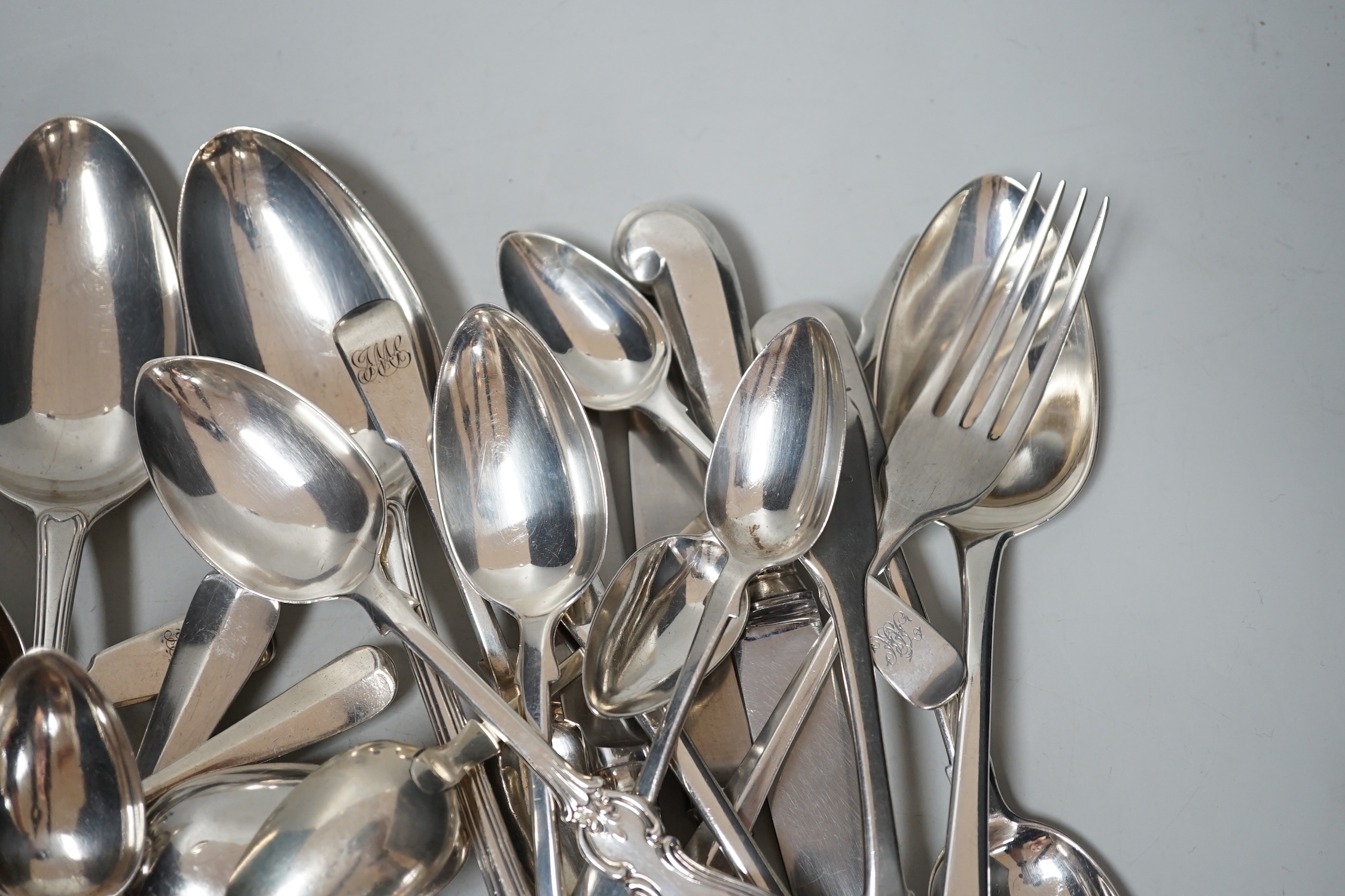 A canteen of mixed George III and later silver flatware, various patterns, dates and makers, 48.6oz.